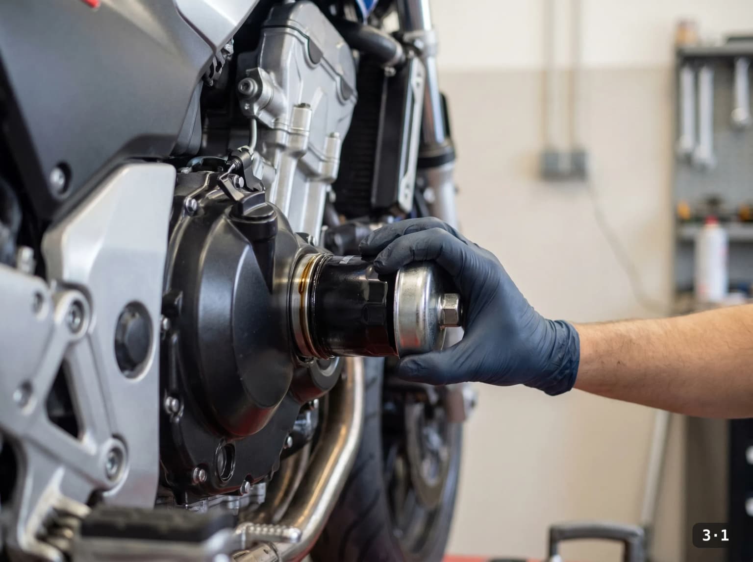 Backing the spin-on filter off with a cup wrench.
